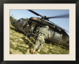 US Army Soldiers Board a UH-60 Black Hawk Helicopter