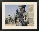 Us Army Soldier Armed with a Mk 48 Light Machine Gun  Provides Rear Security During Civil Affairs