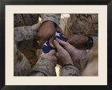 Marines Fold an American Flag after It was Raised in Memory of a Fallen Soldier