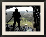 Airman Watches a Practice Bundle Fall from a C-17 Globemaster Iii