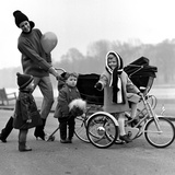 Jenny Boyd in Light Pants and Boots with Children  1960s