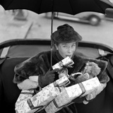 Woman in Fur Coat Carrying Gifts  1960s