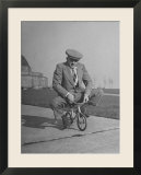 Humorous of Man Riding Tiny Bicycle