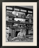 Butcher Standing at Meat Counter of Deli