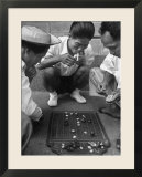 Boys Playing Board Game on Sidewalk in Front of the Trocadero Hotel