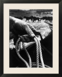 The Rough  Weathered Hand of an Oldtime Cowboy  Holding Rope