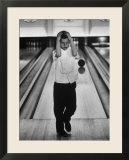 Child Bowling at a Local Bowling Alley