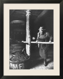 Man Using Old Wine Press at Vaux En Beauiplais Vineyard