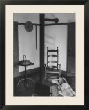 Iron Woodstove with a Ladder Backed Wooden Armchair in a Restored Shaker Parlor