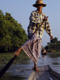 Village Girl Poles Her Wooden Canoe  Myanmar