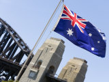 An Australian Flag Flutters in Breeze in Front of Iconic Sydney Harbour Bridge  Sydney