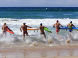 Surf Lifesavers Sprint for Water During a Rescue Board Race at Cronulla Beach  Sydney  Australia
