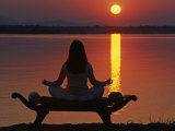 Yoga on a Saddle Bench Watching the Sun Go Down across the Zambesi River  Zambia