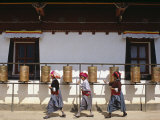 Mosu Women Push Prayer Wheels at a Small Monastery on Liwubi Island  China