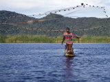 Fisherman in Dugout Canoe Casts Net in Shire River  Lake Malawi's Only Outlet  Southern End of Lake