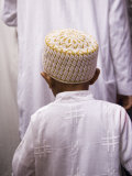 Boy Follows His Father Through the Crowds Outside the Sayyida Ruqayya Mosque  Damsacus  Syria