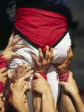 Many Hands Help Support the Base of a Human Castle During the Festival of La Merce in Barcelona