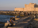 Friends and Couples Gather at Sunset Outside the Citadel of Quatbai  Alexandria  Egypt
