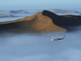 Safari Flights over Red Sand Dunes of Sossusvlei with Early Morning Mist  National Park  Namibia