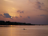 Fishermen Paddles His Small Boat across Tadjoura Bay at Sunrise
