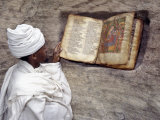 Priest of Ethiopian Orthodox Church Reads Old Bible at Rock-Hewn Church of Yohannes Maequddi