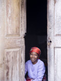 Woman Looks Out from Her Doorway on Ilha Do Mozambique