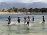 Children Enjoy a Boat Race in a Lagoon at Qalansiah  an Important Fishing Village in the Northwest 