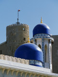 Ornate Domes and Minaret of the Khor Mosque Contrast with the Old Walls of Fort Mirani