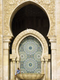 Casablanca a Visitor Is Dwarfed by the Towering Mosaic Tilework of the Hassan Ii Mosque  Morocco