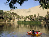 Family Rows Out onto the Oasis Lagoon of Huacachina  Near Ica in Southern Peru