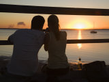 Queensland  Fraser Island  A Couple with Video Camera in Hand Watch Sunset from a Pier  Australia