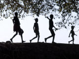 In Late Afternoon  a Group of Dassanech Children Walk Along Bank of Omo River in Southwest Ethiopia