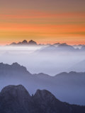 View over Mountaintops at Dusk from Mangrt Pass Looking from Slovenia Towards Italy at Sunset