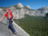 Rock Climber Ascends Slabs at the Base of the Huge Cliff known as the Apron  Yosemite Valley