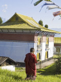 Novice Monk Carries Offering to Sangachoeling Gompa  the Second Oldest Gompa in Sikkim