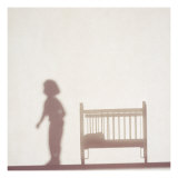 Silhouette of a Female Doll Next to a Crib