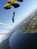 Members of US Navy Parachute Team  the Leap Frogs  Perform Bi-Plane with Parachutes Above Seattle