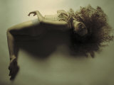Woman Reclined in a Swim Like Position