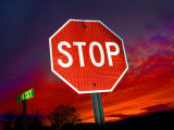 Stop Sign with an Intense Red Sunset in the Backround