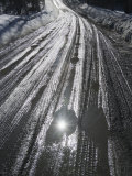 Muddy Wet Road Reflecting the Sunlight