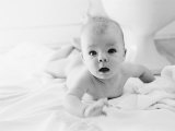 Nude Baby Lying on Bed