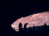 Group of Rafters Huddle in a Cave