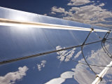 Parobolic Mirrors at a Solar Thermal Plant are Used to Heat Oil