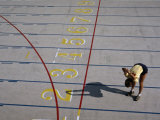 Woman Stretches at the Penn State Track