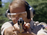 38 Cal Revolver Is Aimed by a Montgomery Co Police Officer