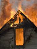Local Fire Fighters Use a Controlled Burning of a House for Practice