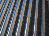 Oil Piped Down Long Rows of Reflectors Soaks Up Focused Sunlight