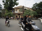 People Ride Motorcycles Through the Streets of Hanoi  Vietnam