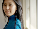 Young Chinese Woman Wearing a Traditional Chinese Blue Cheongsam