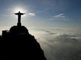 Christ the Redeemer Statue at Sunrise Above the Clouds